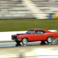 A drag racing car at speed on the strip